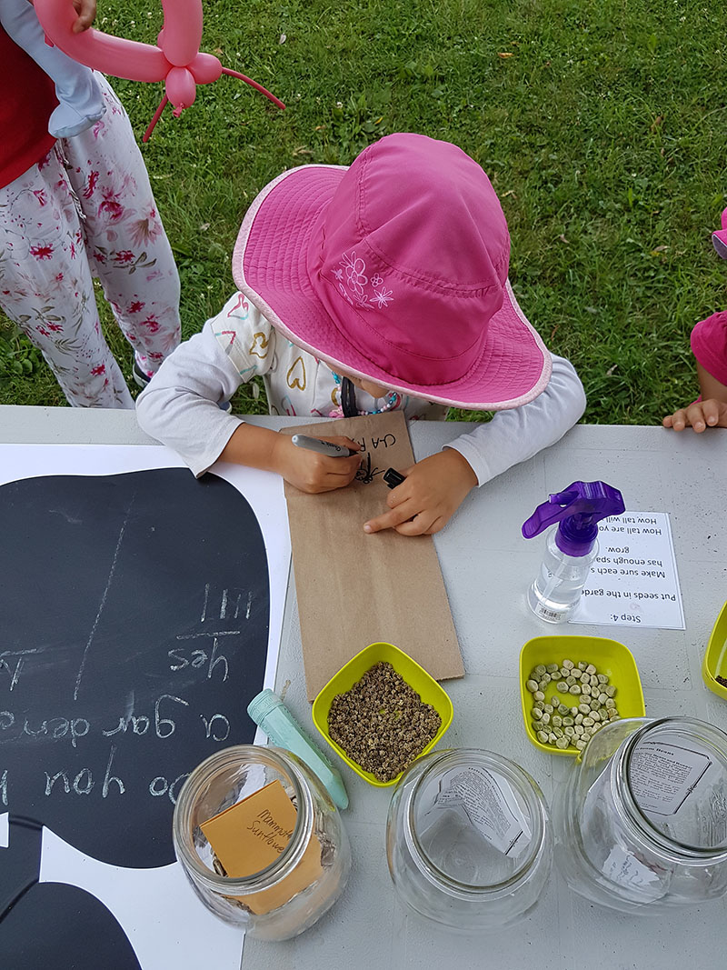 a child colouring at a table